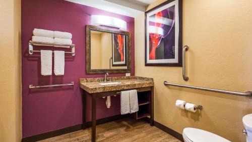 a bathroom with a sink and a toilet at Best Western View of Lake Powell Hotel in Page