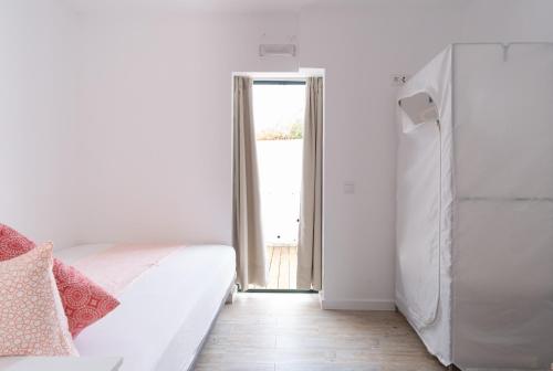 Ένα ή περισσότερα κρεβάτια σε δωμάτιο στο Sunshine Hostel