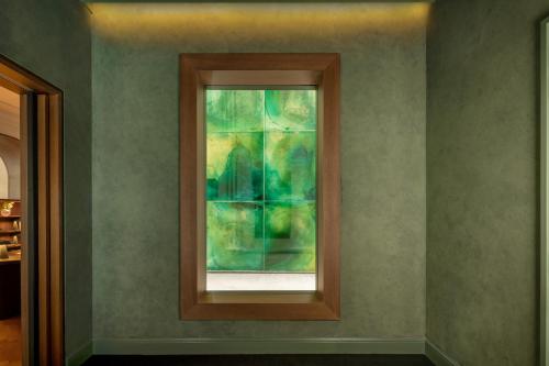 a painting of a window in a room at Alma Barcelona GL in Barcelona