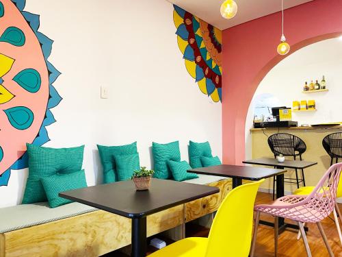 a living room filled with furniture and decor at Hostal Macondo Bogotá in Bogotá