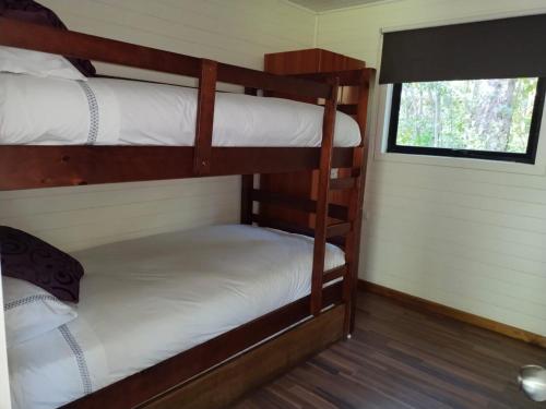 Postel nebo postele na pokoji v ubytování Cabañas Nordic lodge
