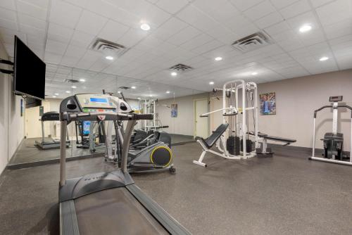 a gym with several tread machines and a treadmill at Best Western University Inn in Ithaca
