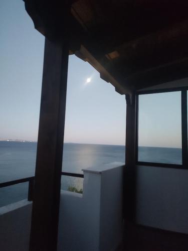 a view of the ocean from a room with windows at Blue Seaview Suites in Piraeus