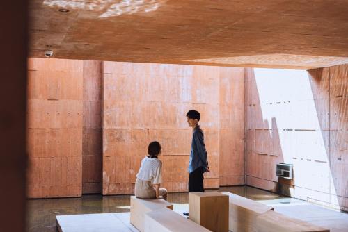 a man and a woman standing in a room at SEKIYA RESORT Galleria Midobaru in Beppu