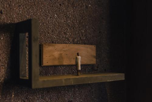 a figurine standing on a shelf in a wall at SEKIYA RESORT Galleria Midobaru in Beppu