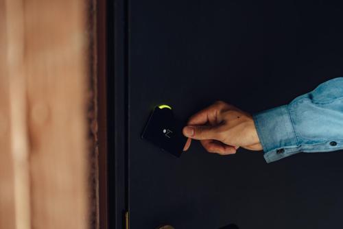 a person is unlocking a door with their hand at SEKIYA RESORT Galleria Midobaru in Beppu