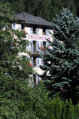 a building with a sign on the side of it at Excelsior Chamonix Hôtel & Spa in Chamonix-Mont-Blanc