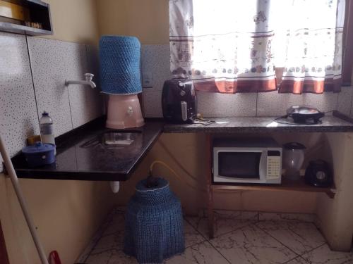 Dapur atau dapur kecil di Sobrado aconchegante