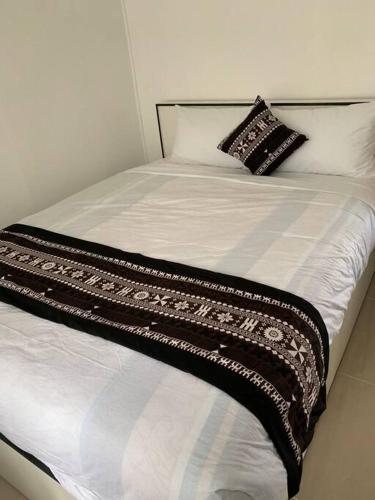 Ein Bett oder Betten in einem Zimmer der Unterkunft Bula Holiday Inn