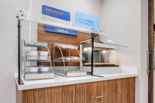 a bakery counter with some food on display at Holiday Inn Express & Suites Macon - I-475 by IHG in Macon