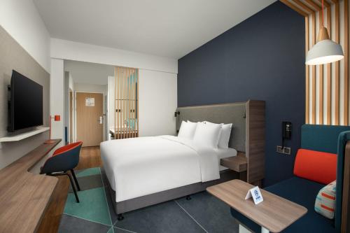 Ένα ή περισσότερα κρεβάτια σε δωμάτιο στο Holiday Inn Express Guiyang Qingyan by IHG