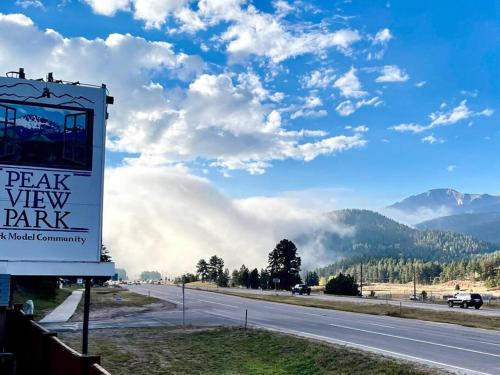 a sign on the side of a highway at NEW! Boutique TinyHome w/Direct View of PikesPeak! in Woodland Park