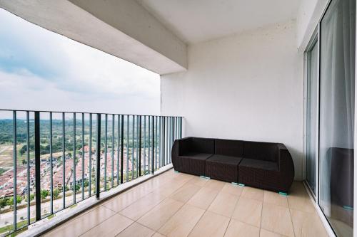 a room with a black couch on a balcony at Sky Bungalow NIlai by James NEARBY KLIA, KLIA 2, CYBERJAYA, PUTRAJAYA in Nilai