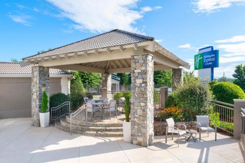 a pavilion with tables and chairs on a patio at Holiday Inn Express & Suites Asheville SW - Outlet Ctr Area by IHG in Asheville