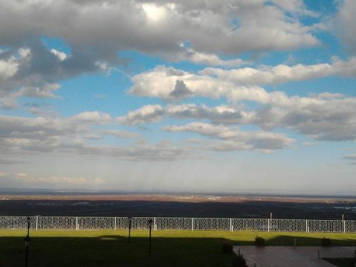 a view of a tennis court under a cloudy sky at Veriopolis Hotel in Veria