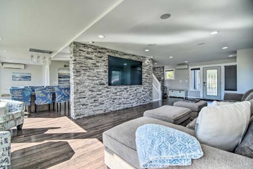 a living room with a stone wall at Home on Fox River Modern Decor Style! in McHenry