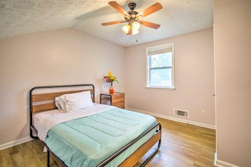 a bedroom with a bed and a ceiling fan at Picturesque Kennesaw Home with Private Backyard in Kennesaw