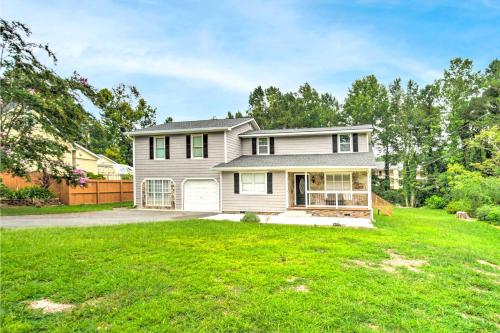a house with a green lawn at Picturesque Kennesaw Home with Private Backyard in Kennesaw