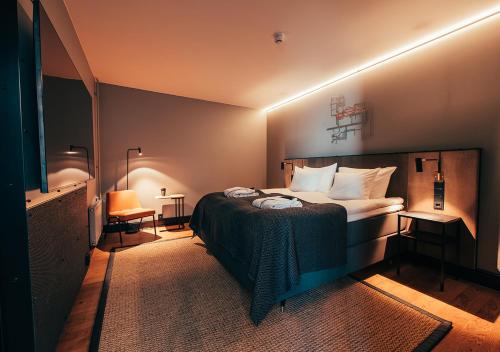 Postel nebo postele na pokoji v ubytování Clarion Hotel Mestari