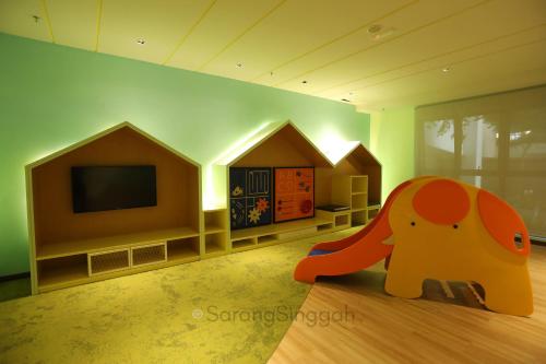 a childs room with an elephant and a tv at SarangSinggah@Timurbay Seafront in Kuantan