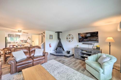 a living room with leather furniture and a fireplace at Walk to Ski Resort! Sugar Mtn Haven with Lake Views in Sugar Mountain