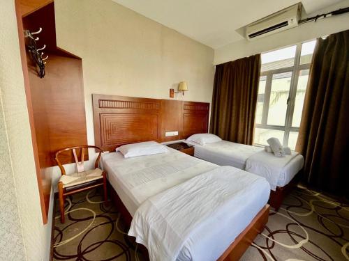 Ένα ή περισσότερα κρεβάτια σε δωμάτιο στο Fan Holiday Hotel