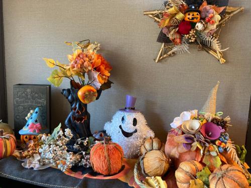 a table topped with halloween decorations and pumpkins at Ryoso Chatani in Kyoto