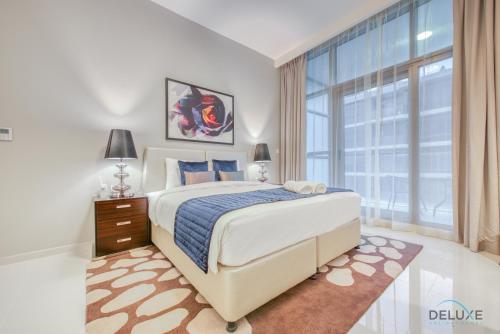 Postel nebo postele na pokoji v ubytování Stunning Studio at Golf Promenade 2A Damac Hills by Deluxe Holiday Homes