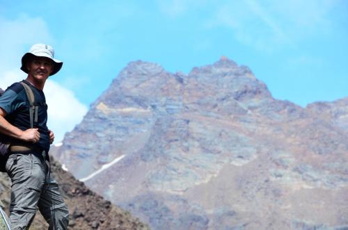 a man standing on the top of a mountain at Natur Pur Hotel Unterpichl in Ultimo