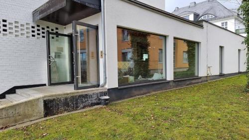 a house with large windows on the side of it at Hotel Credé in Kassel