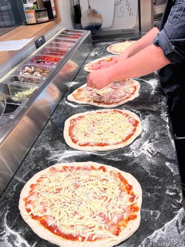 a group of pizzas sitting on top of a counter at Hotel Credé in Kassel