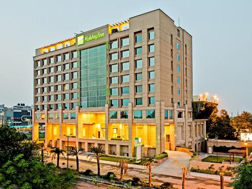a hotel building with a lot of windows at Holiday Inn Amritsar Ranjit Avenue by IHG in Amritsar