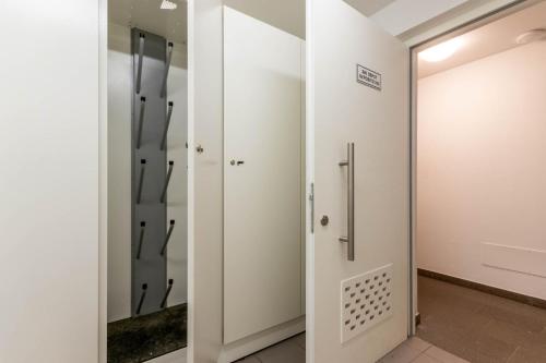 a walk in shower in a room with a mirror at Alpine View Plan de Corones in Sorafurcia