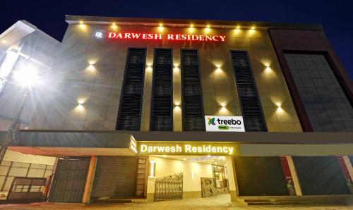 a building with a sign that reads dawlish residency at Treebo Darwesh Residency - 500m from Railway Station in Kozhikode