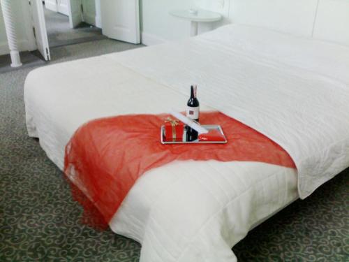 Ένα ή περισσότερα κρεβάτια σε δωμάτιο στο Kar's Hotel
