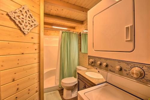 a small bathroom with a toilet and a sink at Clayton Retreat with Spacious Deck and Mtn Views! in Clayton