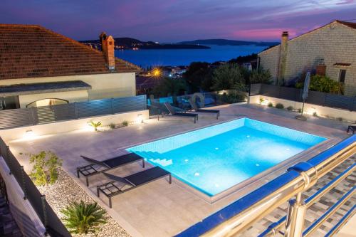 a swimming pool on the roof of a house at Casa della Cava in Trogir