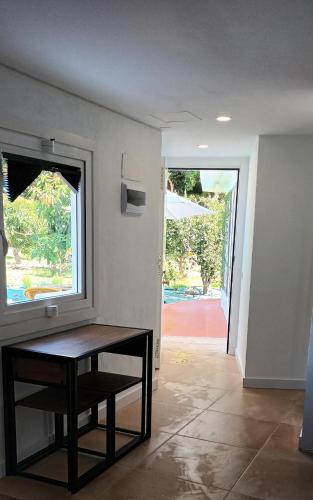 a dining room with a table and a window at Time To Experience in Salobre