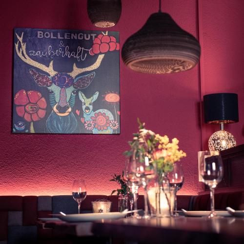 a dining room with a table with wine glasses at Das Blümchen in Freiburg im Breisgau