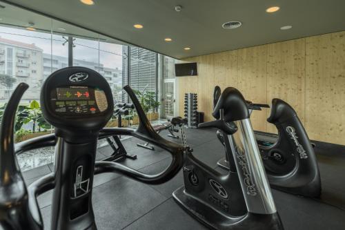 a gym with cardio equipment in a building at The Lince Azores in Ponta Delgada