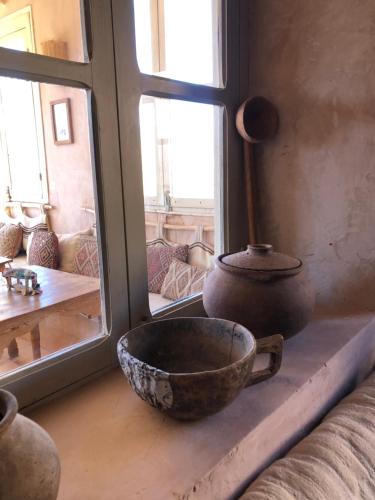 a bowl sitting on a window sill in a room at Maison d'Hôtes Irocha in Tisselday