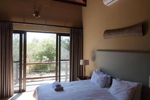 Postel nebo postele na pokoji v ubytování Kruger National Park Mjejane Private Game Reserve