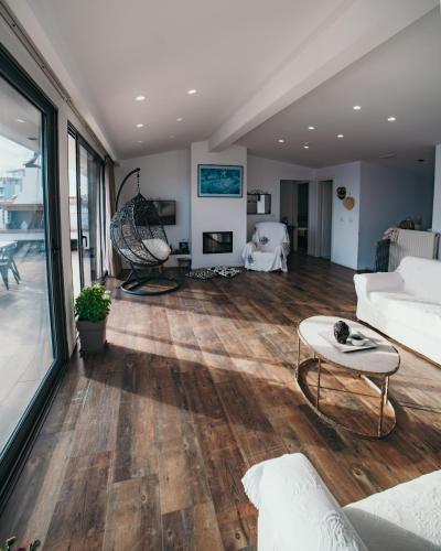 a living room with a couch and a table at Epirus Hotel in Sarandë