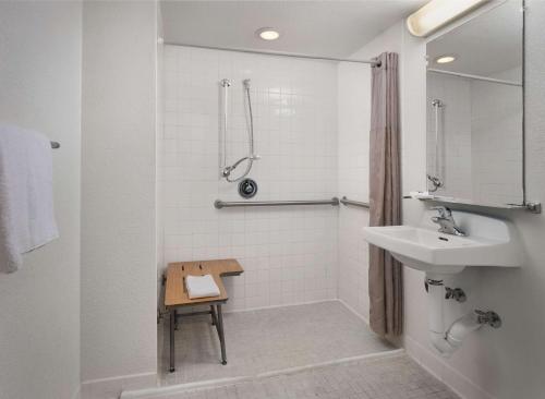 a white bathroom with a sink and a shower at Motel 6 San Simeon, CA - Hearst Castle Area in San Simeon