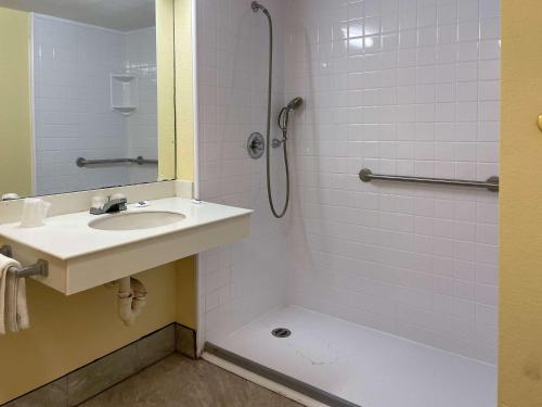 a bathroom with a sink and a shower at Motel 6 Huntsville AL University Dr. in Huntsville