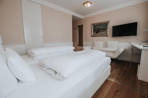 Ένα ή περισσότερα κρεβάτια σε δωμάτιο στο Boutique Hotel am Rathaus - Reblaus