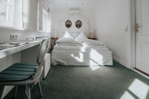 Ένα ή περισσότερα κρεβάτια σε δωμάτιο στο Boutique Hotel am Rathaus - Reblaus