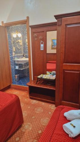 a room with a bathroom with a shower and a bed at New Apartment Marghera in Milan