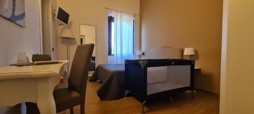 TV a/nebo společenská místnost v ubytování Il Casale degli Ulivi - Agriturismo - TENIMENTI LEONE