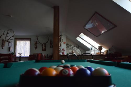 a room with a pool table with balls on it at Holló és Bárány Vendégház in Herend